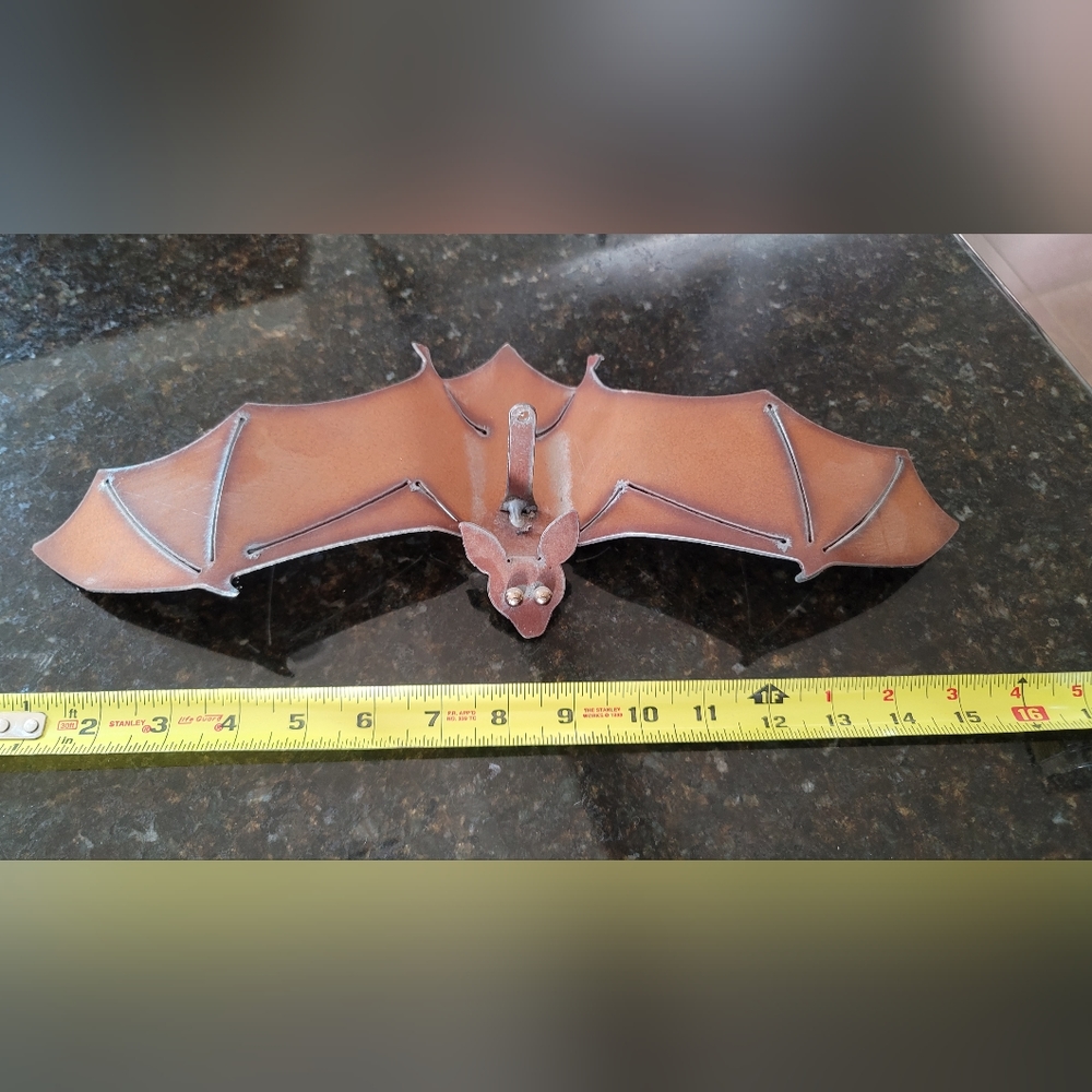 Metal sculpture of a bat